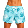 Bañador corto L de tejido sintético azul turquesa con estampado tropical y cordón ajustable