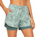 Pantalón corto deportivo de mujer talla S tejido sintético verde agua de doble capa con bolsillos